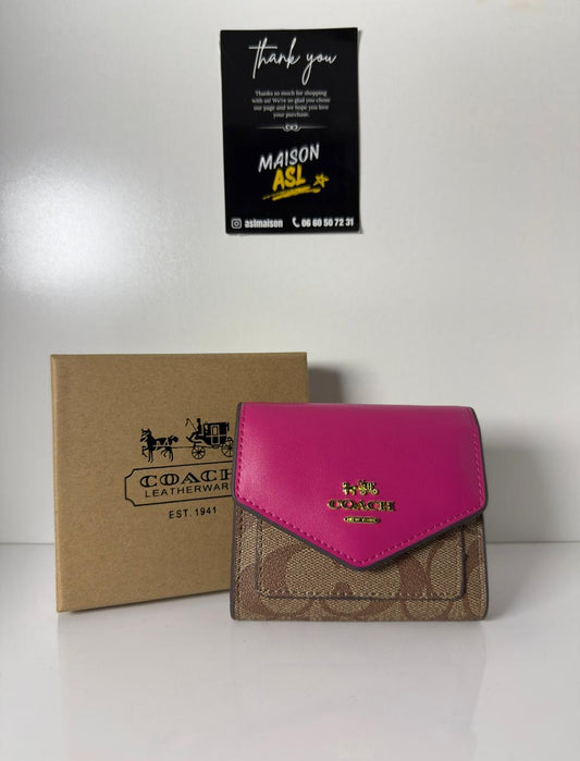 Portefeuille coach rose